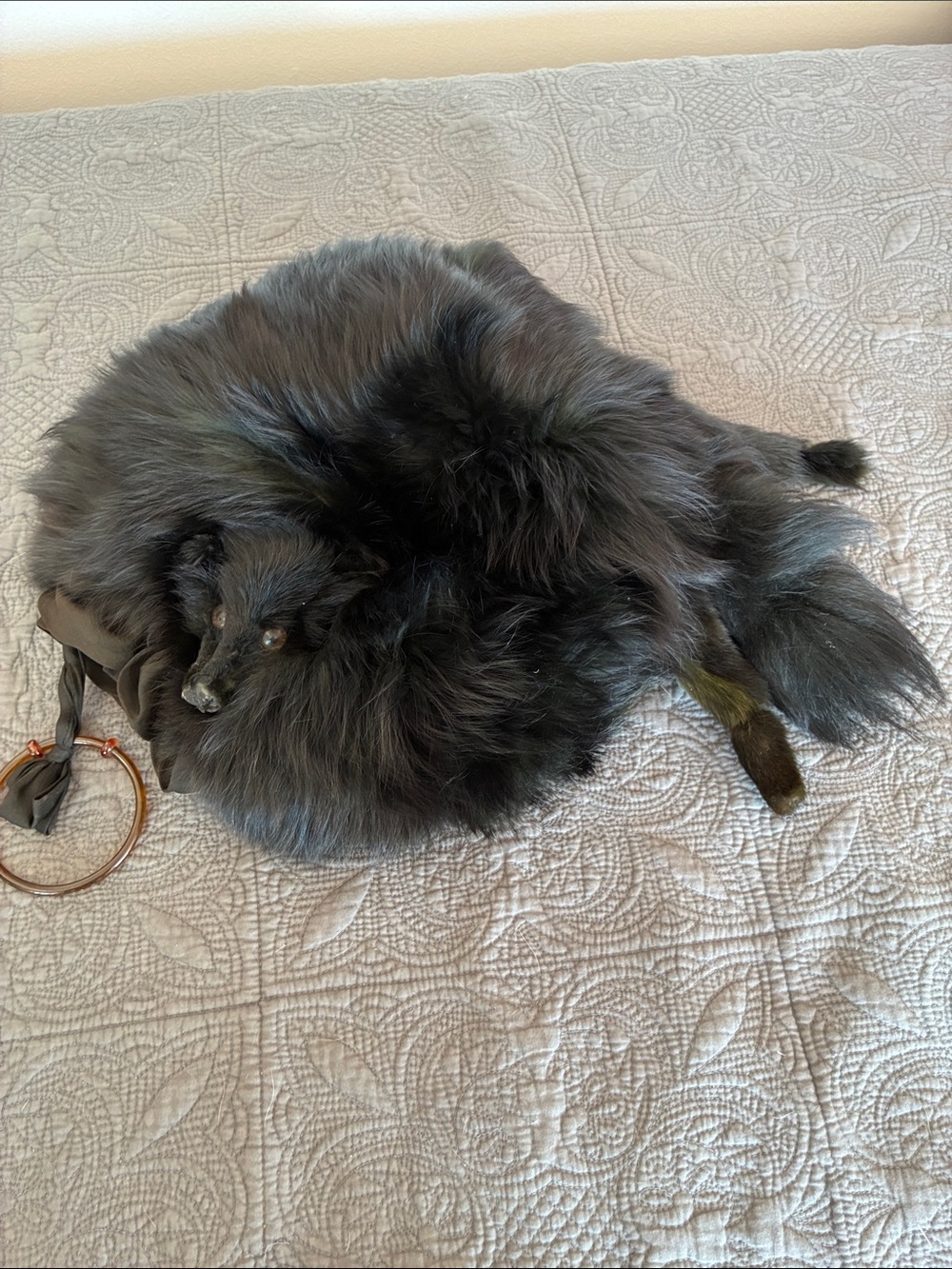 Black Fox fur muff. Black silk interior tortoiseshell handle.